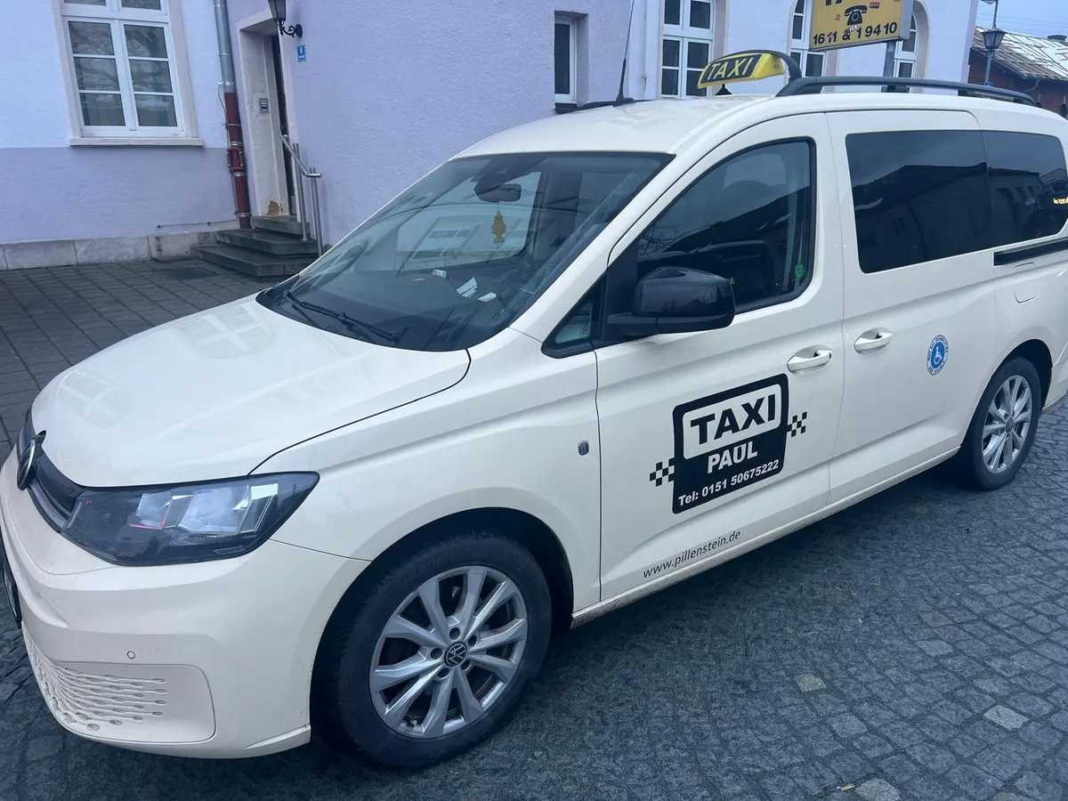 Taxi Paul on duty outside an office building